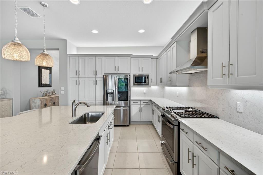 Elegance and gas cooking!!! Soft close drawers, microwave is air fryer and convection oven, too! Upgraded cabinets a huge plus!