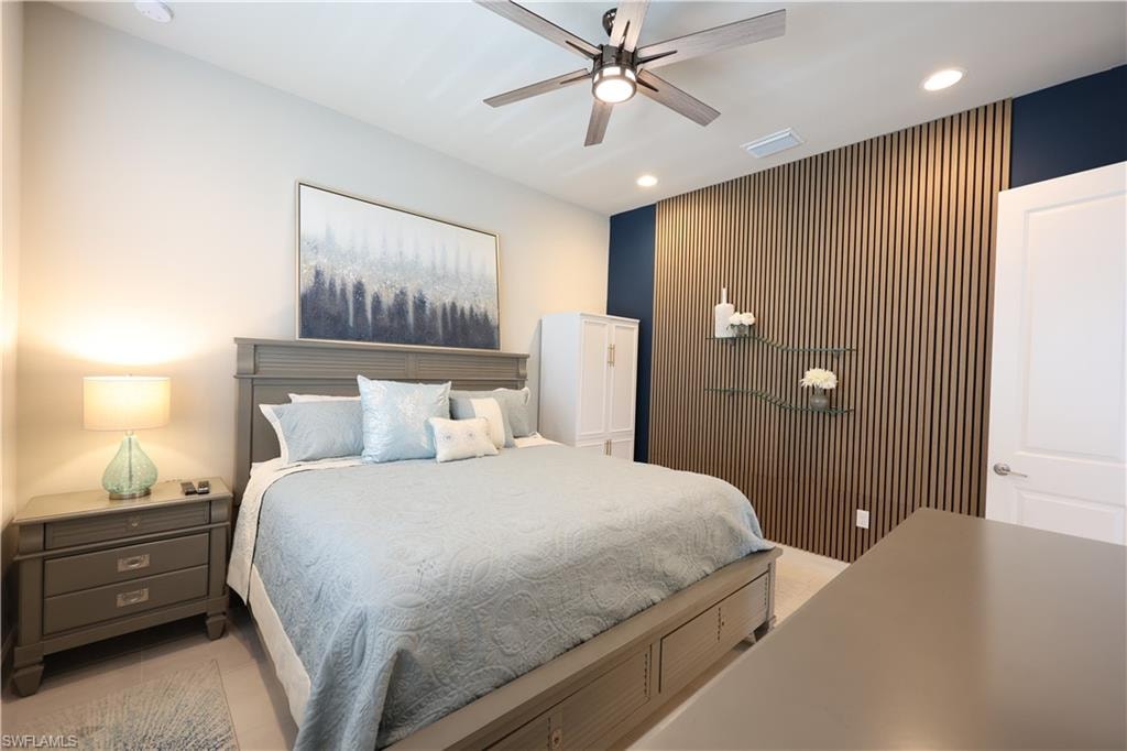 3rd Bedroom or Den featuring an accent wall, and a ceiling fan