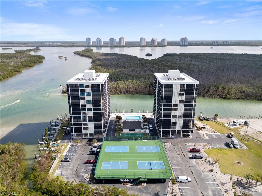 View of urban area with apartment complex / building and a large body of water