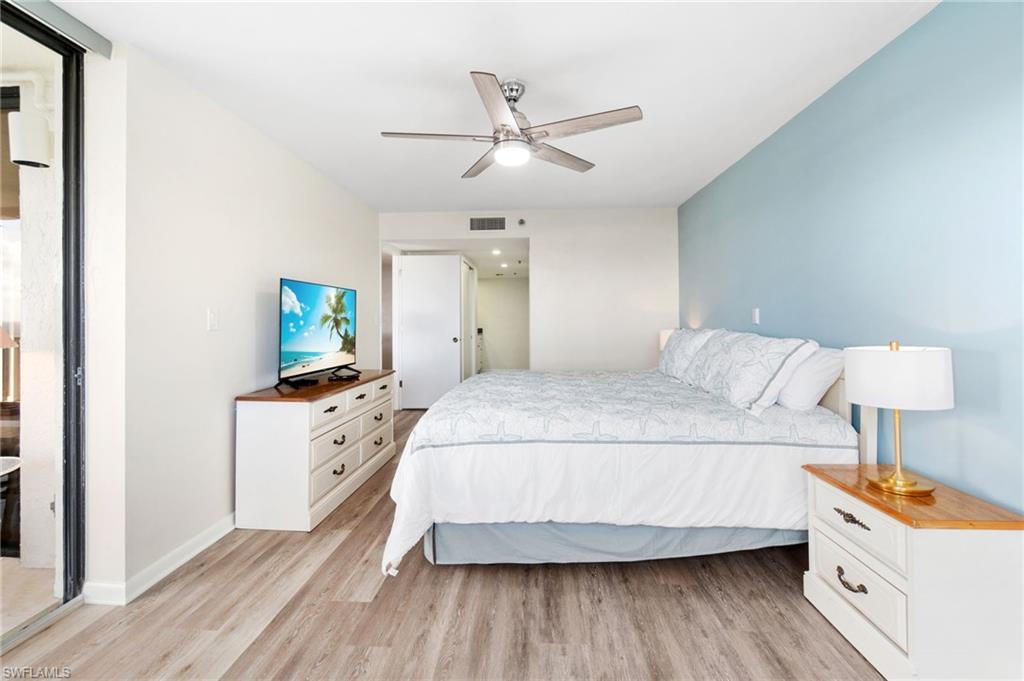 Bedroom with light wood-style flooring and ceiling fan
