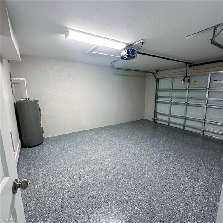 Garage with water heater and a garage door opener