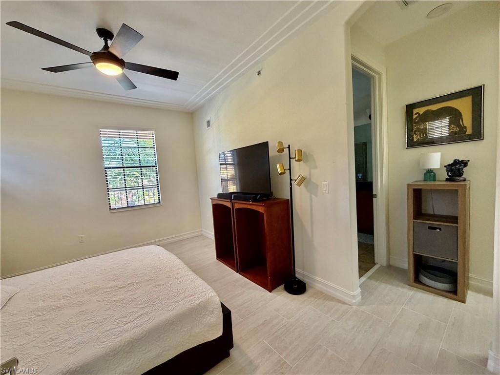 Bedroom featuring crown molding and ceiling fan