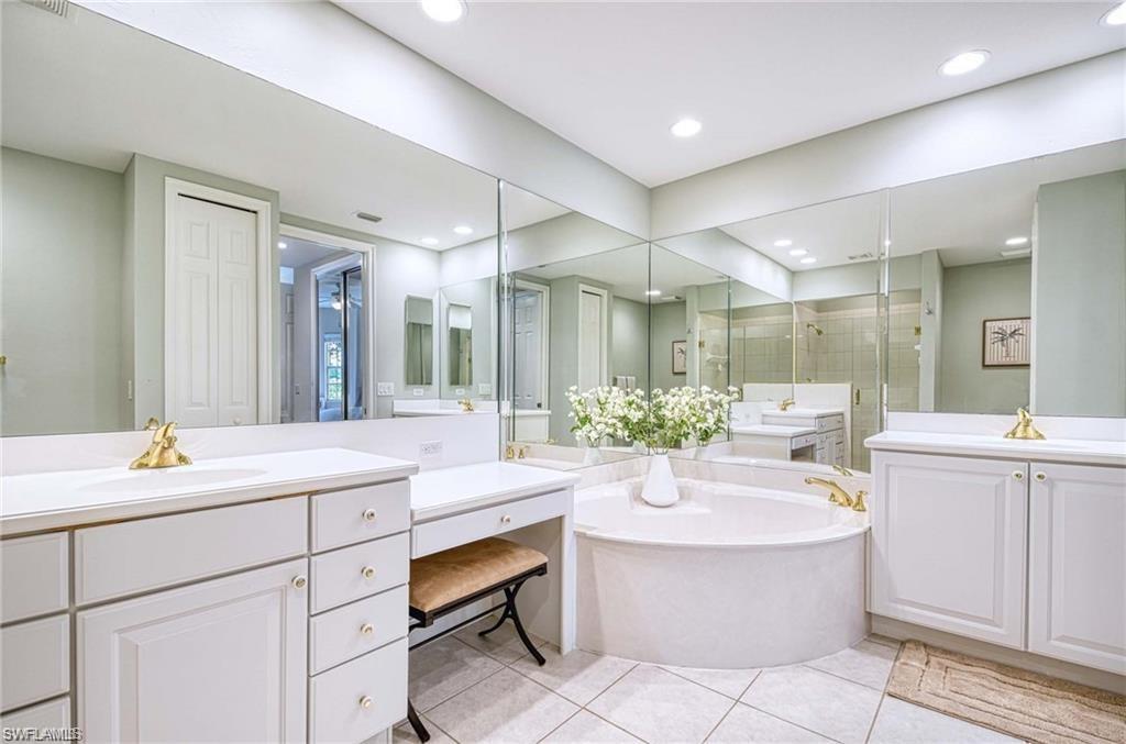 Double vanity, soaking tub, make-up vanity, walk-in shower.