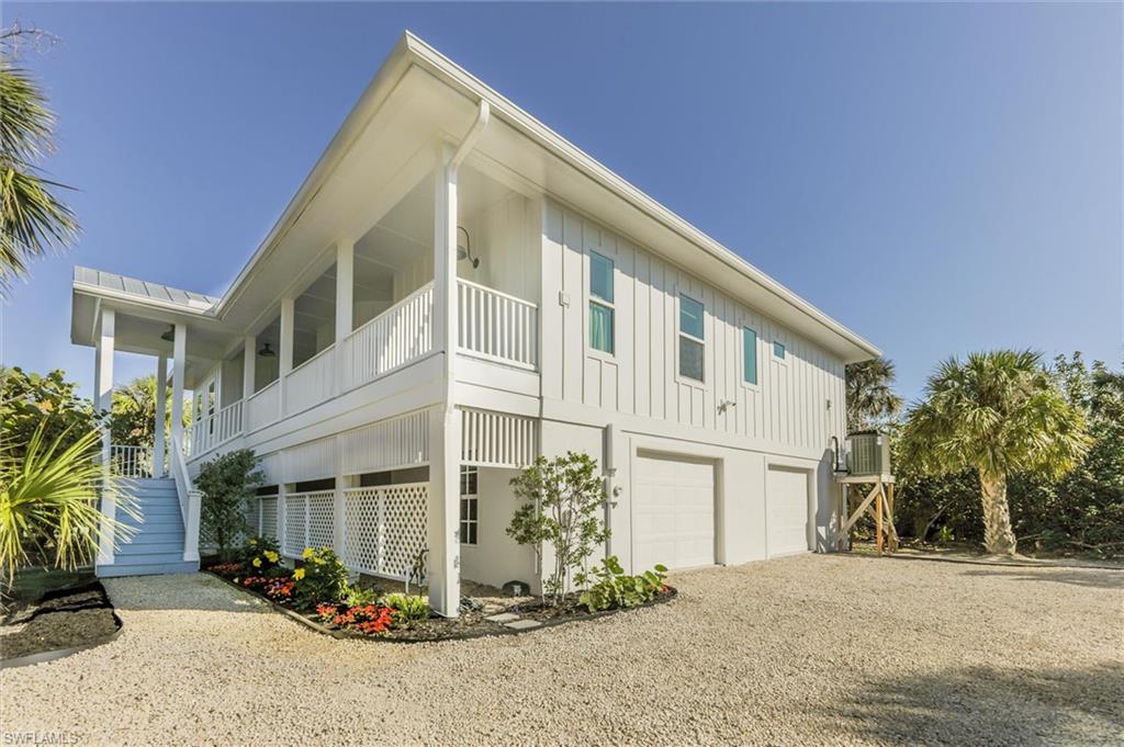 View of home's exterior featuring a garage and a balcony