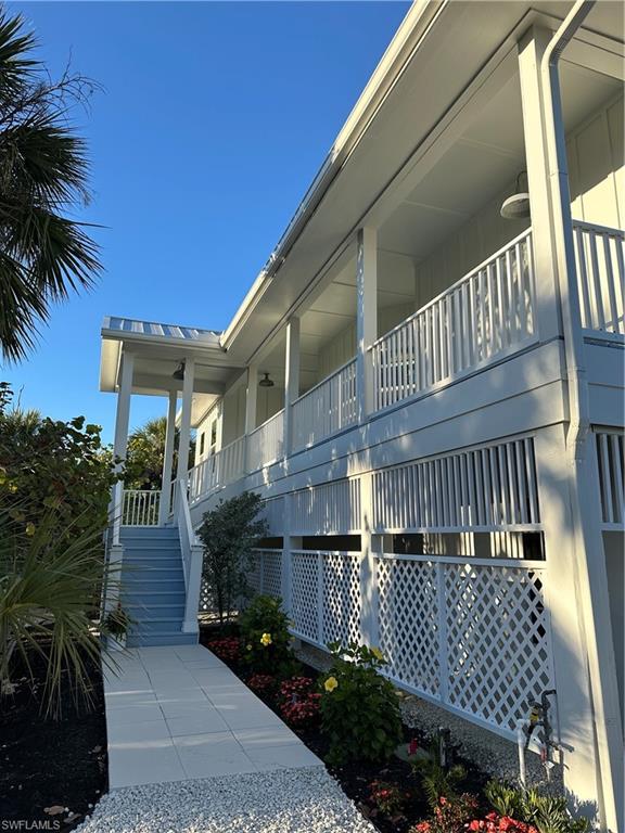 View of property exterior with stairs