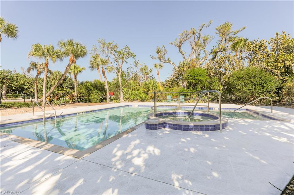 View of swimming pool with hot tub