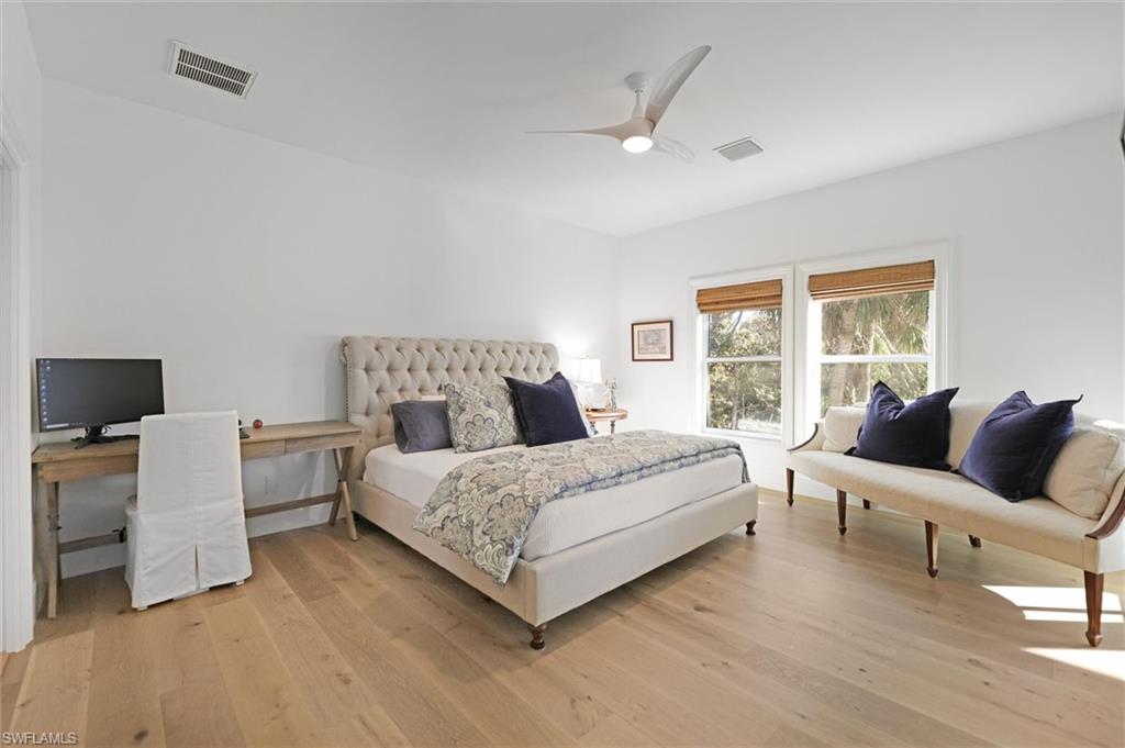 Bedroom featuring ceiling fan and light wood-type flooring