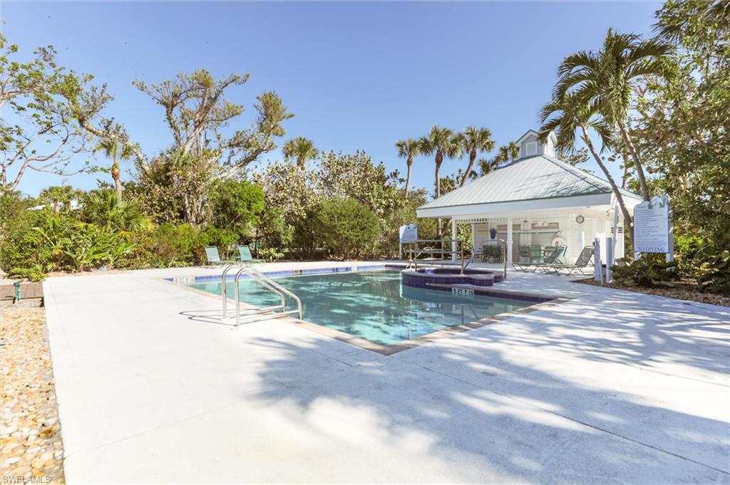 View of pool featuring a gazebo, a community hot tub, and a patio area
