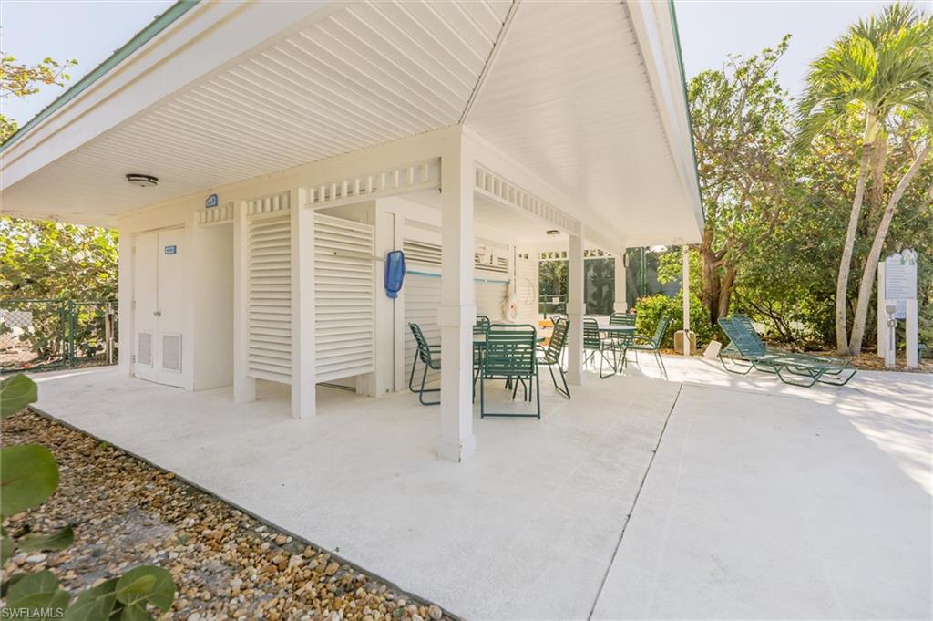 View of pool baths, patio and outdoor furniture