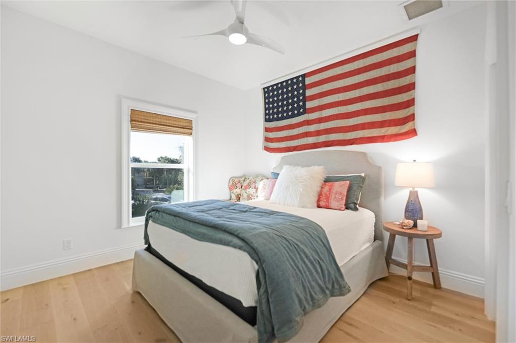 Bedroom featuring ceiling fan and engineered hardwood flooring