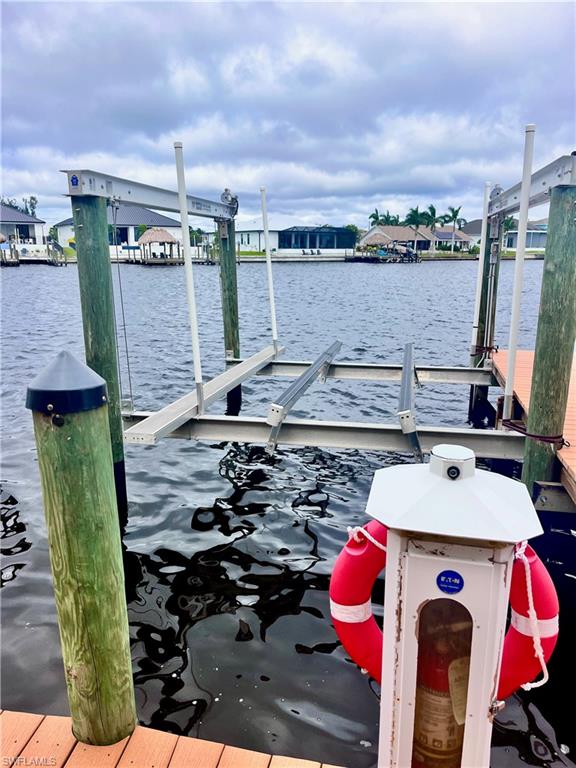 Dock with a water view and boat lift to rent