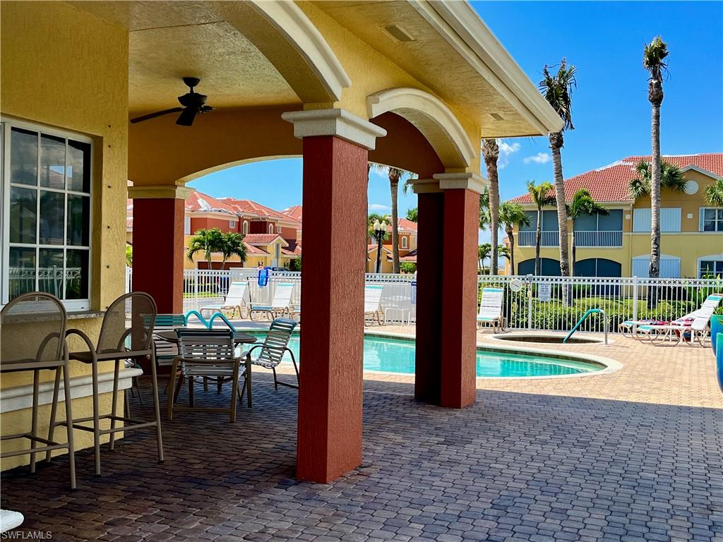 Community pool featuring a patio and ceiling fan