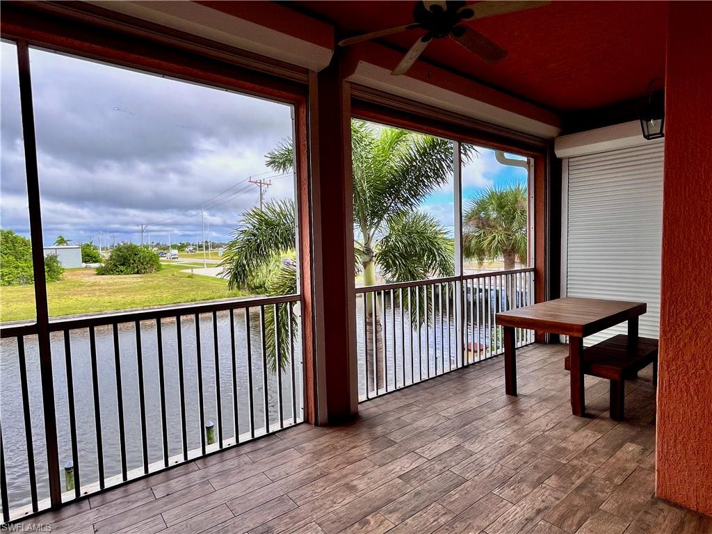 Second floor screened in balcony with a water view