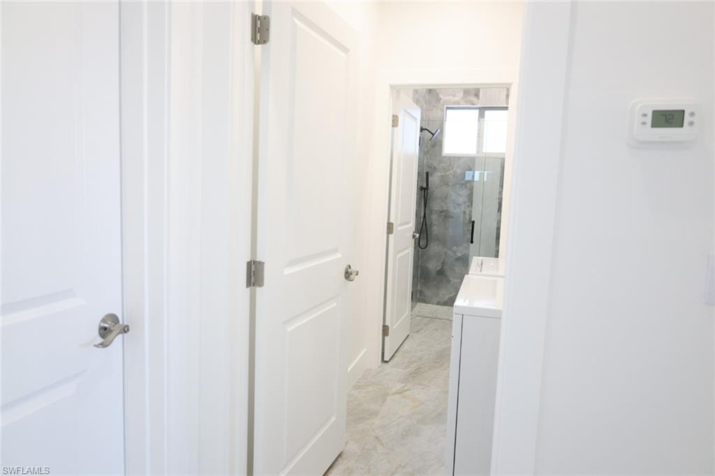 Hallway featuring washer / clothes dryer