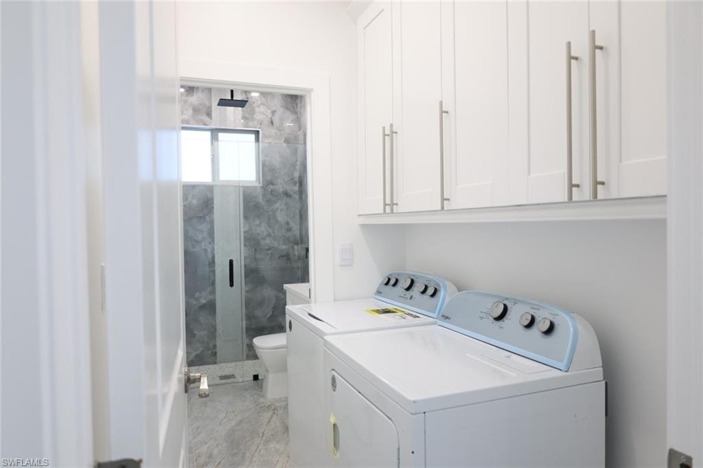 Laundry room featuring independent washer and dryer