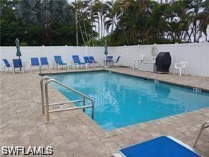 Community pool with a patio