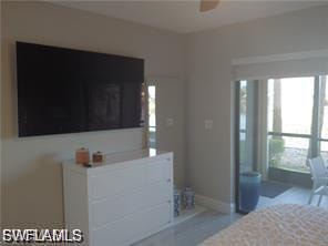 Bedroom with baseboards and a ceiling fan