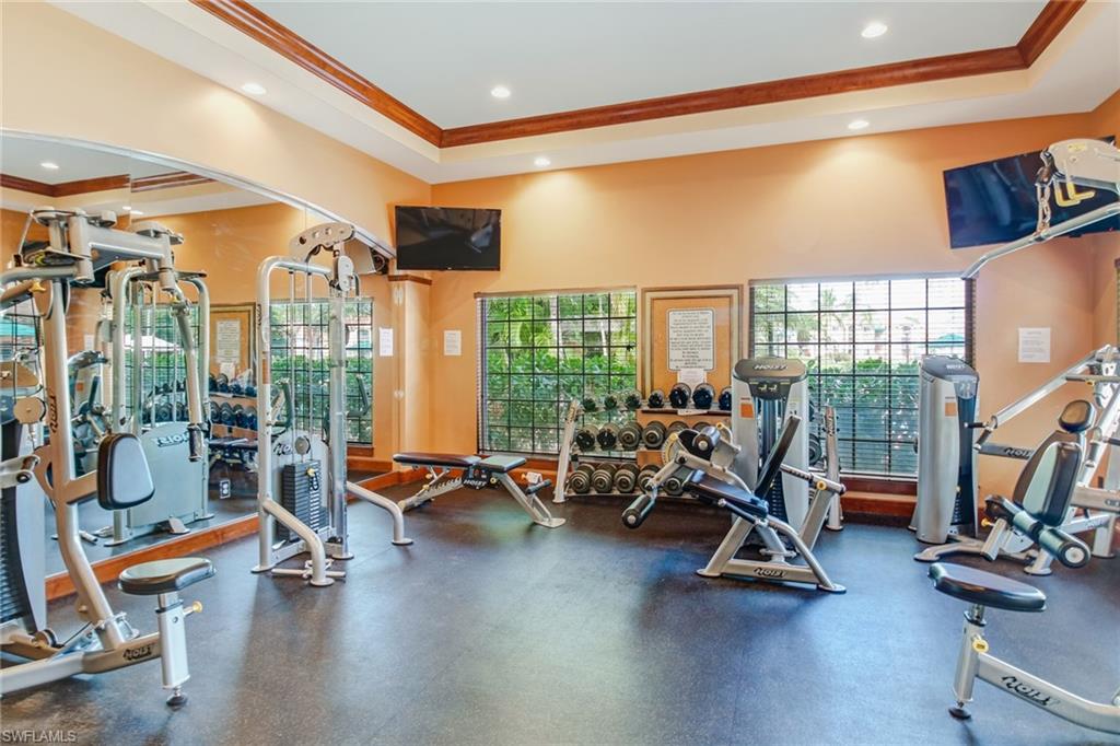 Gym featuring crown molding and recessed lighting