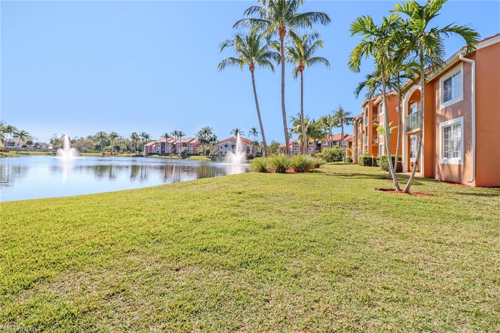 View of grassy yard featuring a water view