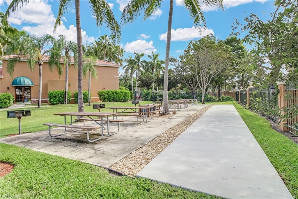 Surrounding community with a yard and a patio area