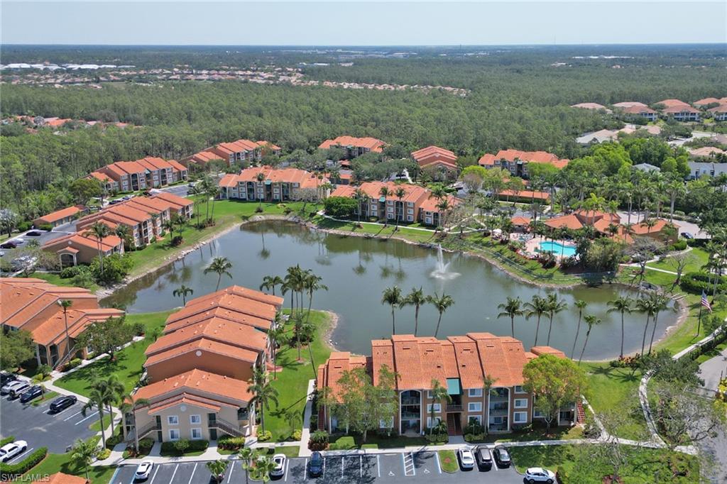 Aerial overview of property's location featuring apartment complex / building and a nearby body of water