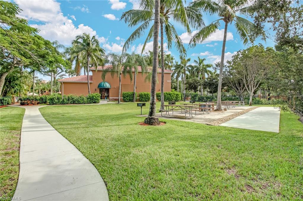 View of home's community featuring a yard and a patio