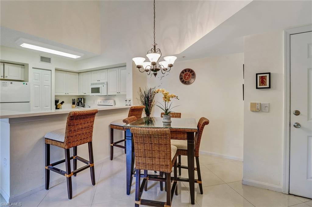 Dining room featuring a chandelier and light tile patterned flooring