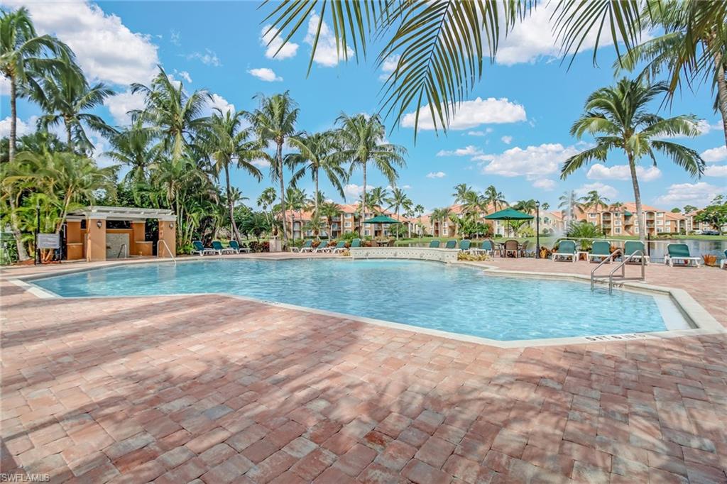 Community pool with a patio