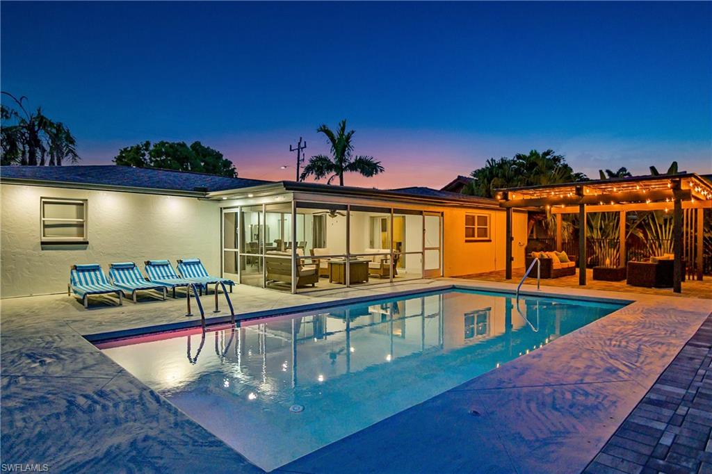 Swimming pool with a patio, outdoor lounge area, and a pergola