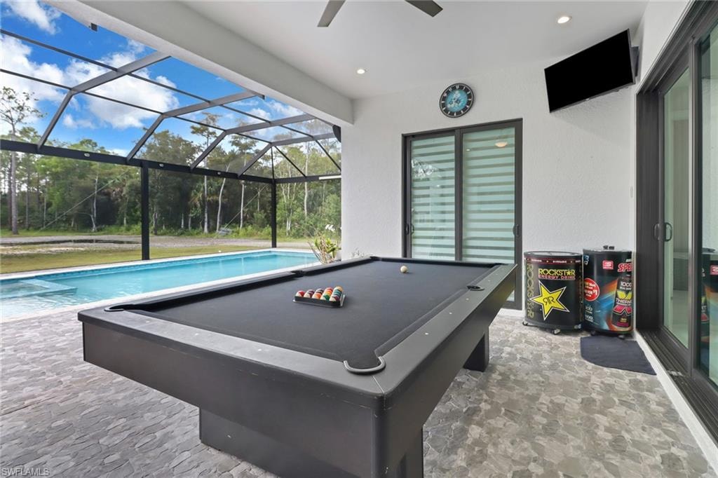 stone finish flooring, recessed lighting, healthy amount of natural light, and ceiling fan