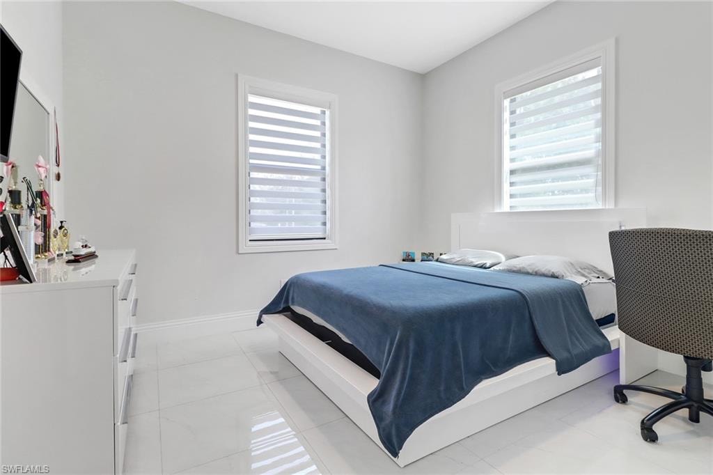 Bedroom featuring light tile patterned flooring