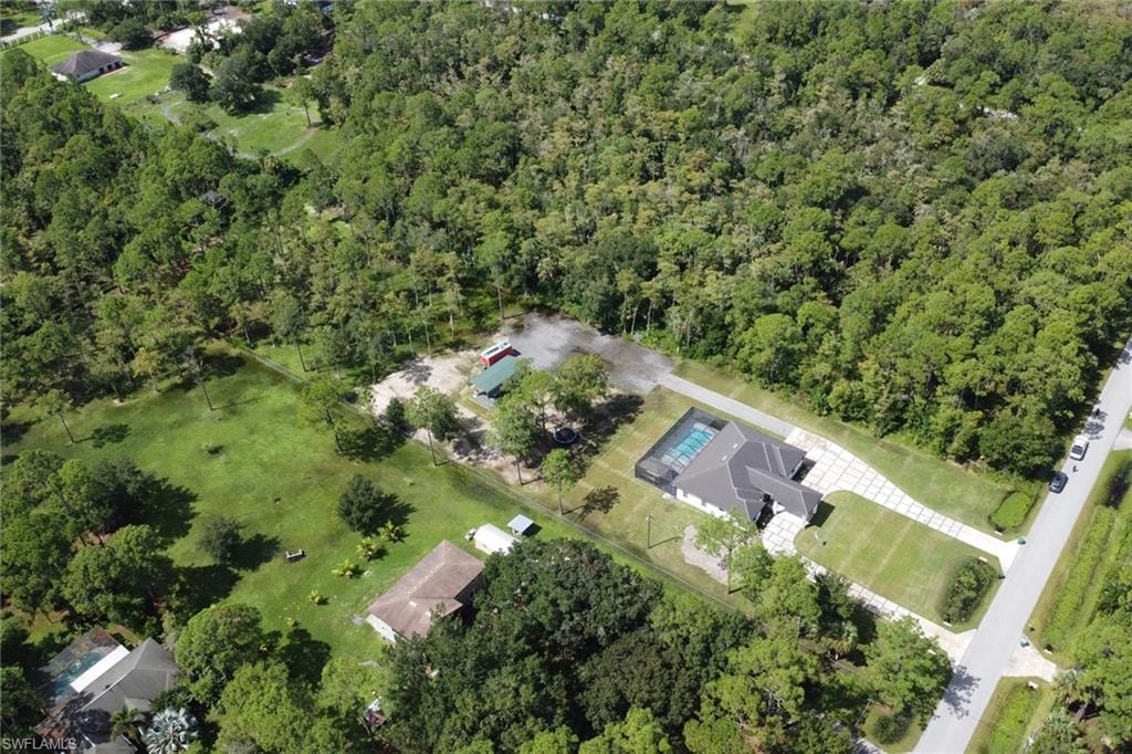 View of property location featuring a heavily wooded area