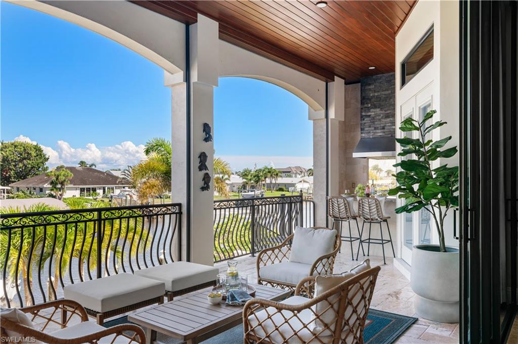 Balcony with an outdoor hangout area and a residential view