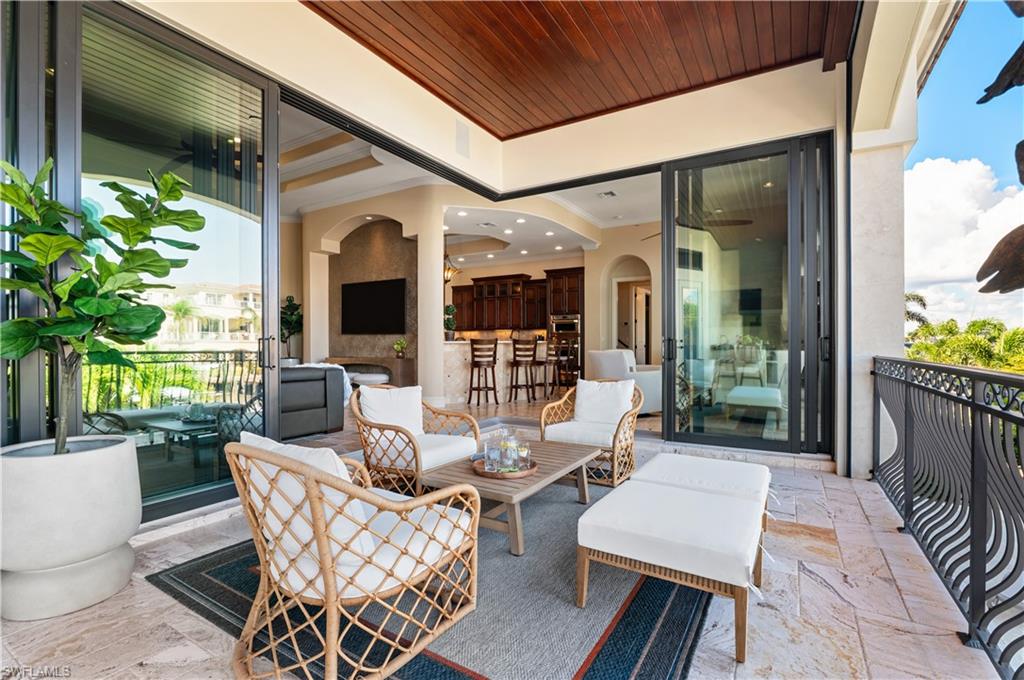 View of patio with an outdoor hangout area