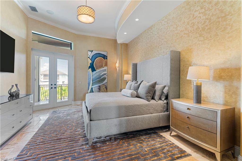 Bedroom with ornamental molding, french doors, recessed lighting, access to exterior, and stone tile flooring
