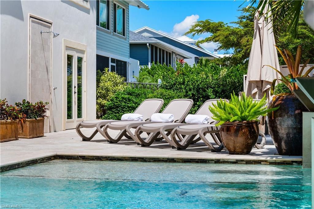 Swimming pool featuring a patio and french doors