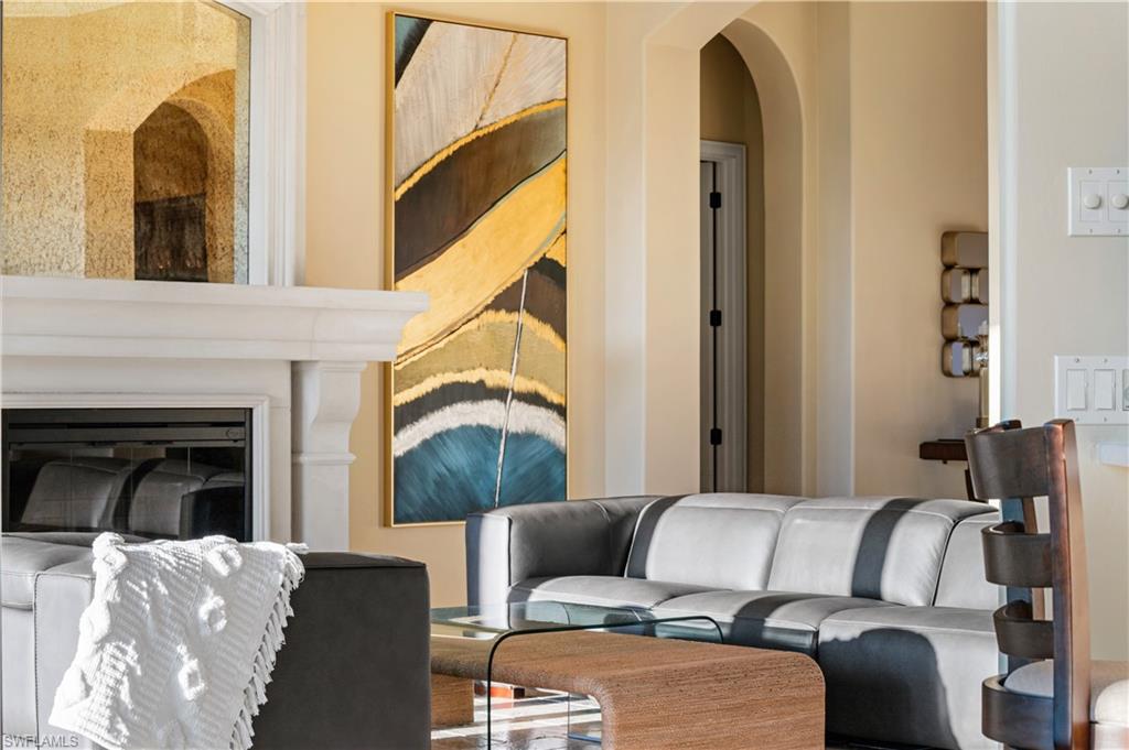 Living area featuring arched walkways