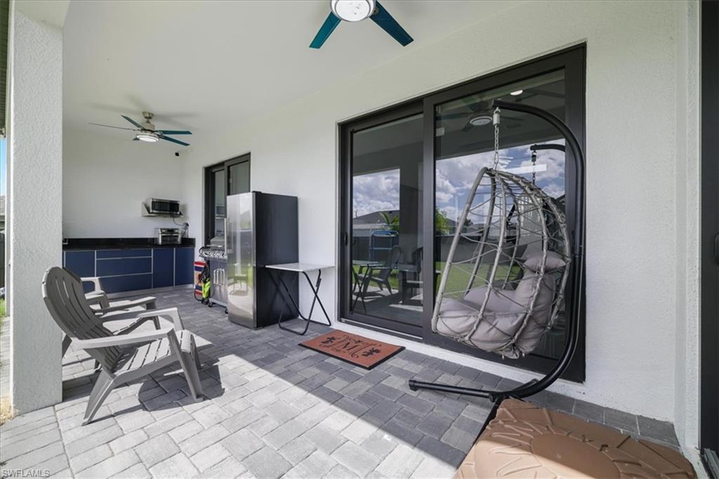View of patio / terrace with a ceiling fan