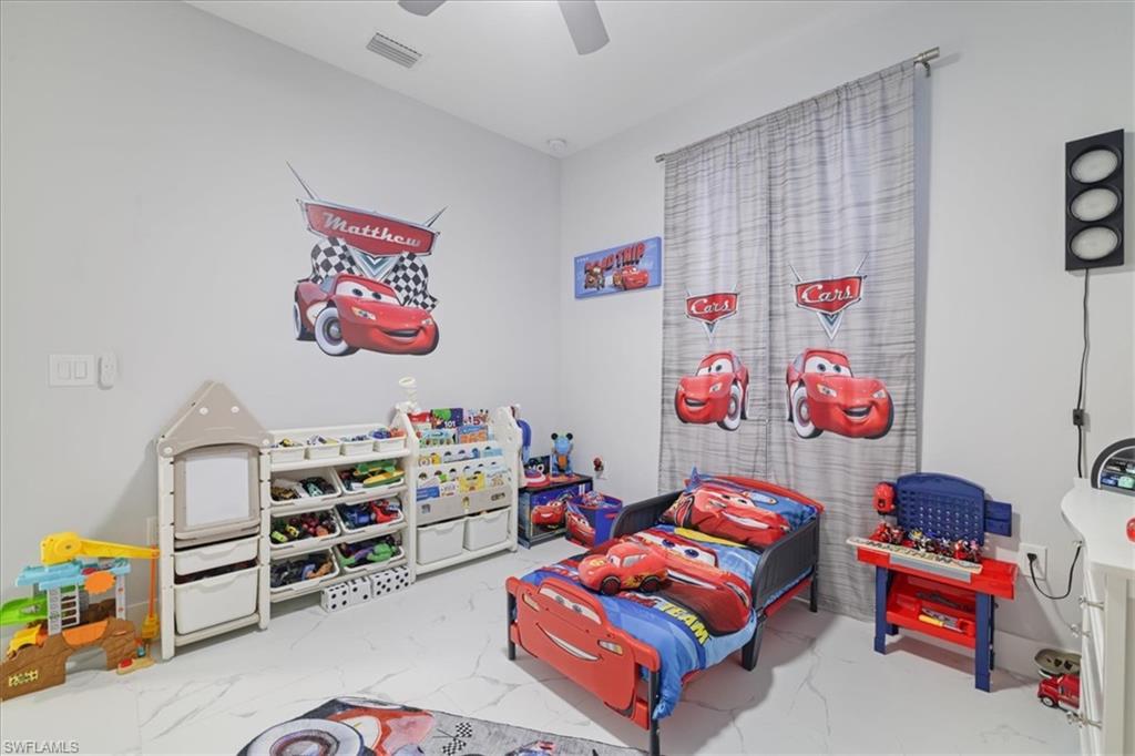 Playroom featuring light marble finish floors