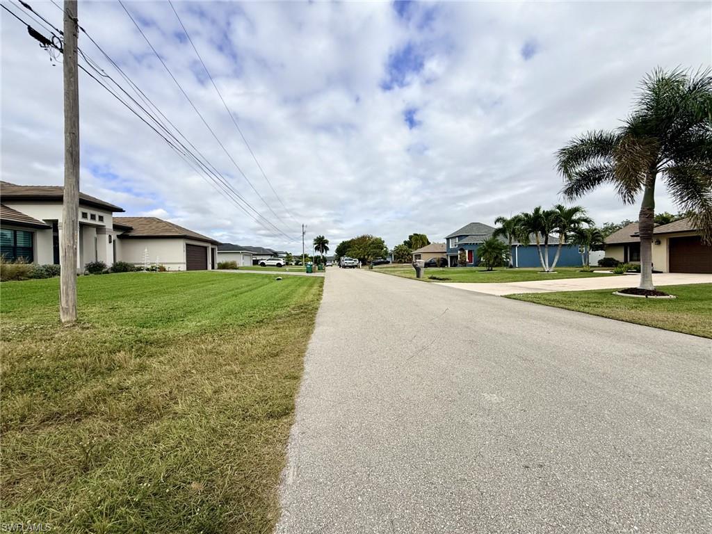 View of asphalt road with a residential view