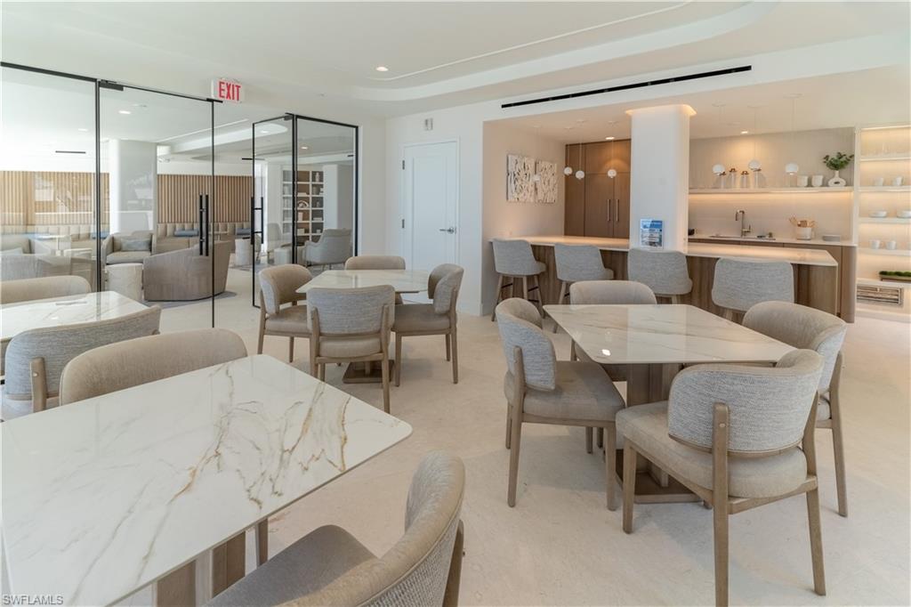 Dining area featuring recessed lighting and a raised ceiling