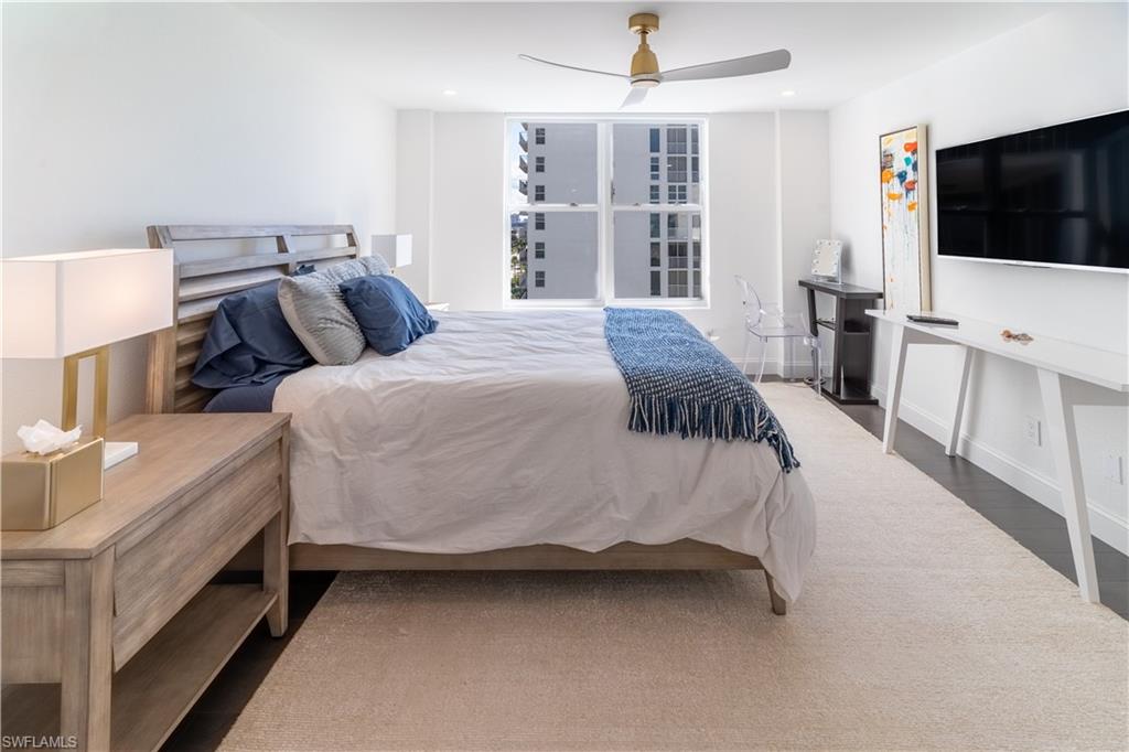 Bedroom with ceiling fan and wood finished floors