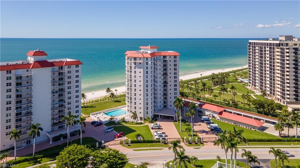 Aerial view of apartment complex and extended coastline