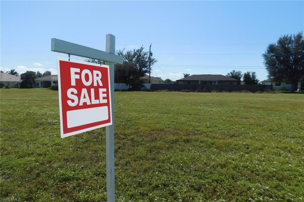 Vacant lot with AI enhancement with "For Sale Sign"