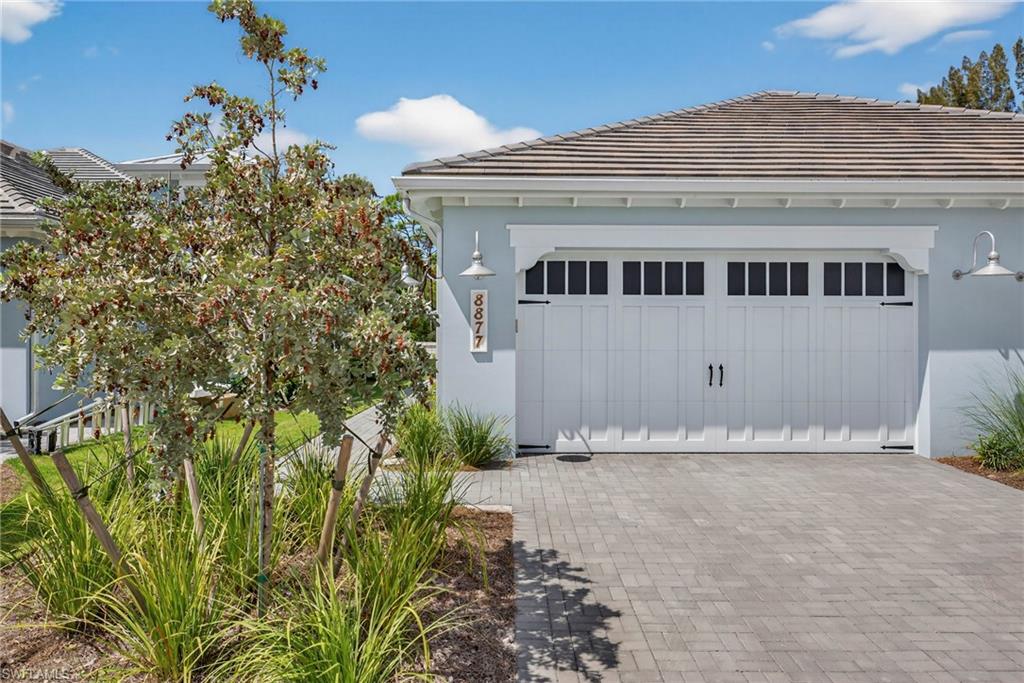 Garage featuring driveway