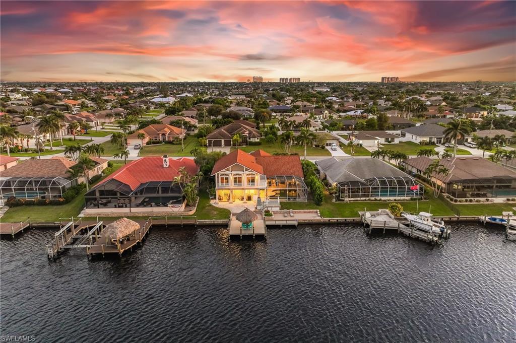 Aerial view at dusk of a residential view and a water view