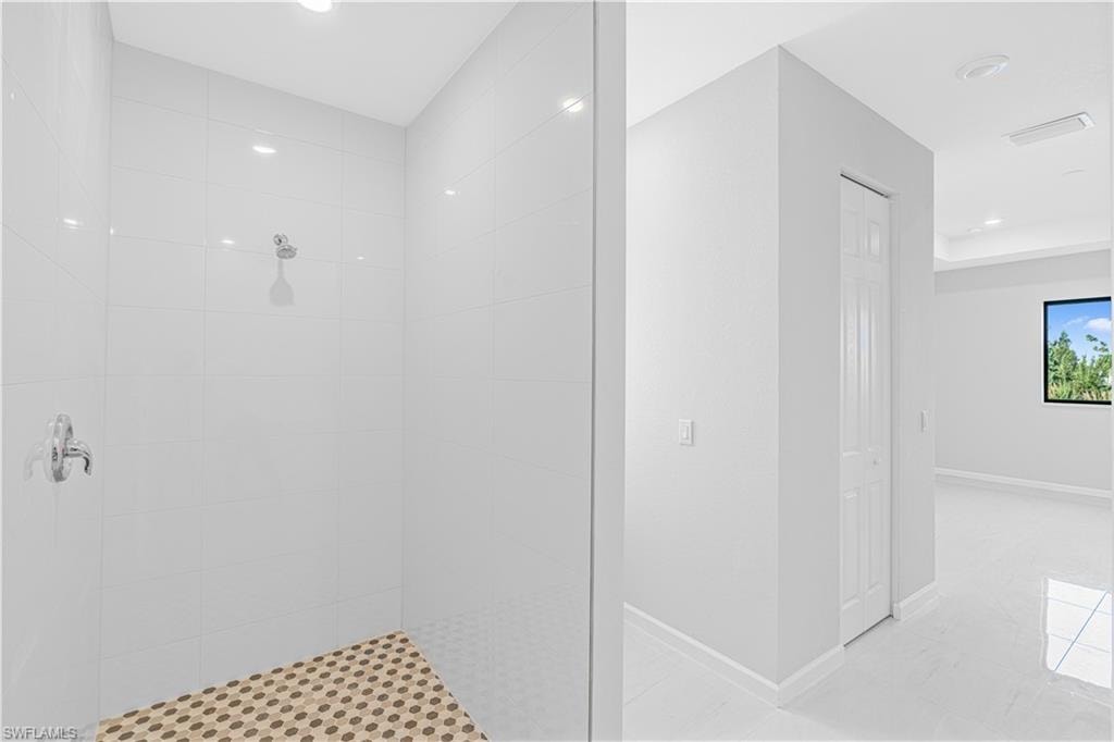 Full bathroom featuring a walk in shower and recessed lighting