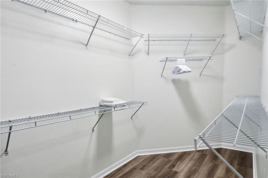 Primary bedroom walk-in closet