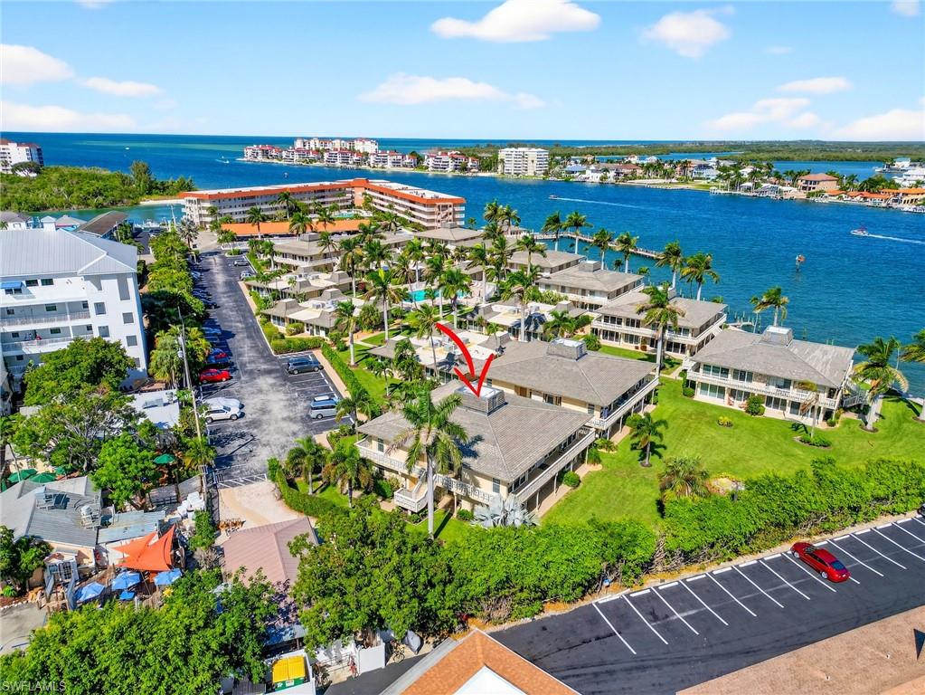 Bird's eye view of a large body of water and apartment complex / building