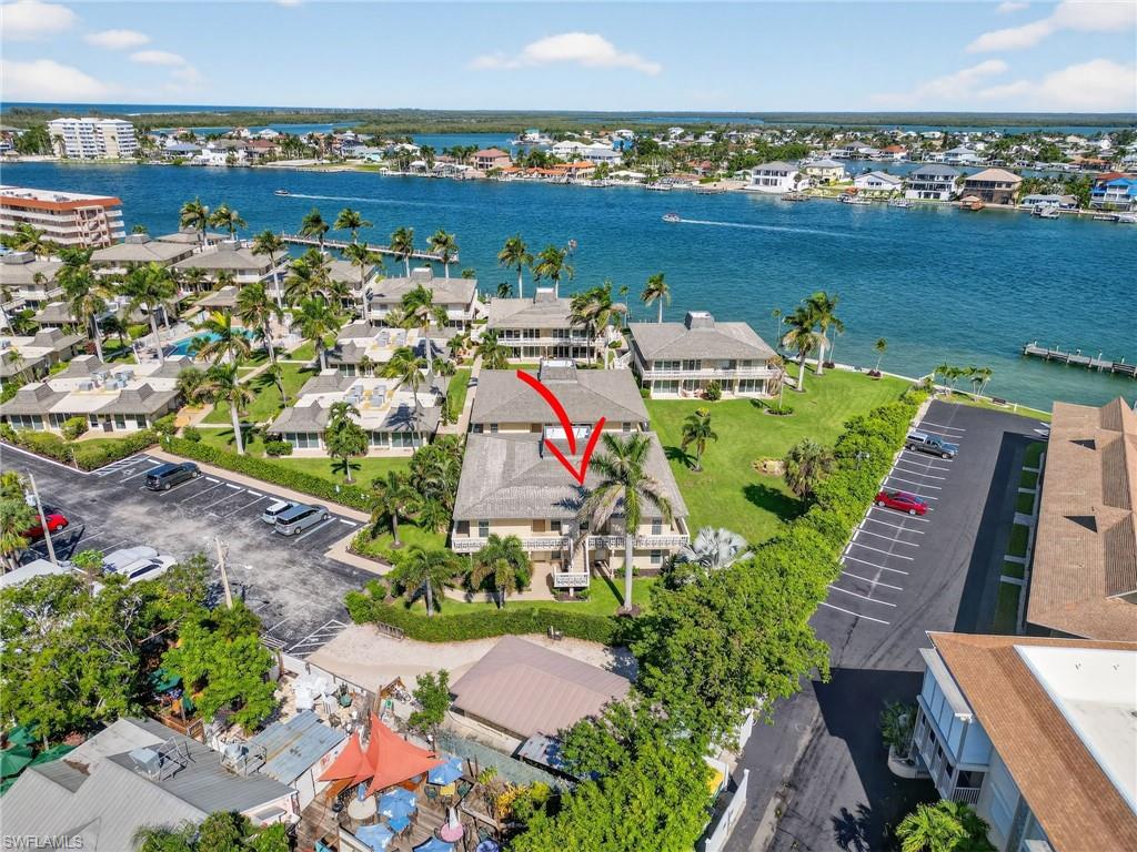 Aerial view of residential area featuring a large body of water